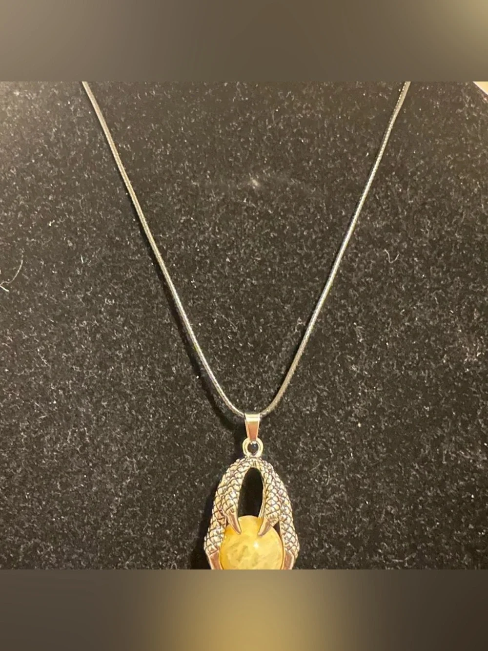 Silver dragon claw pendant necklace with big yellow aventurine crystal ball.